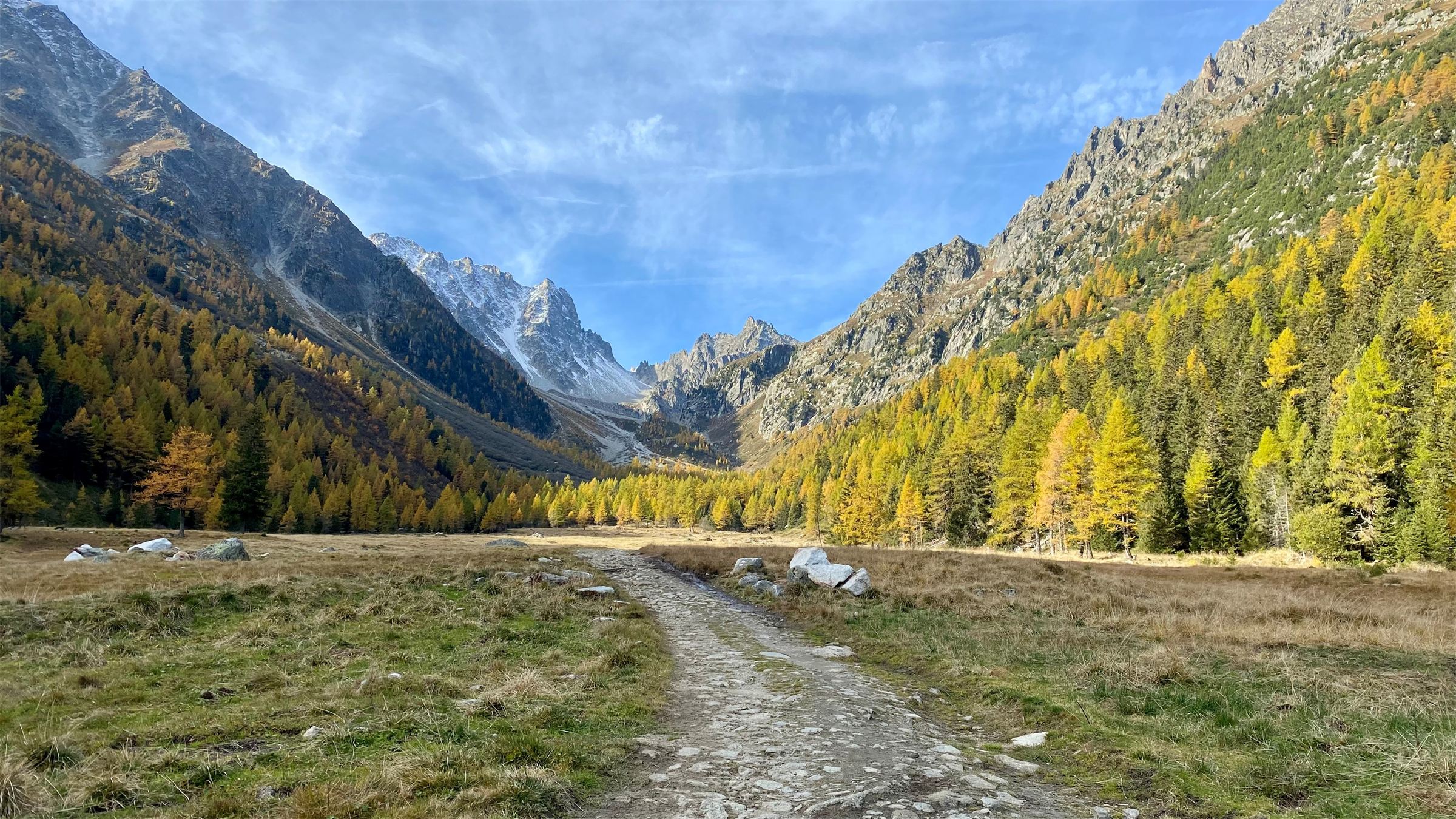 Mountain valley with a stone path in autumn